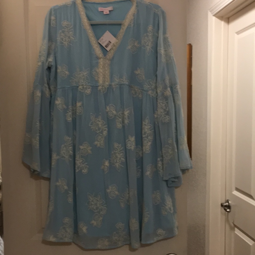 This is a beautiful women blouse, size Large with floral designs
